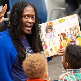 Valerie Kinloch reading to children