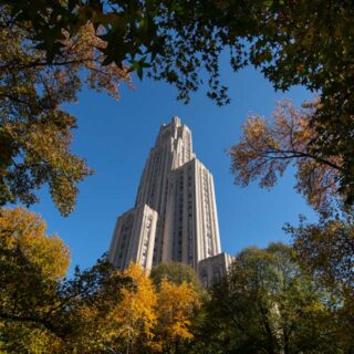 Cathedral of Learning framed by trees