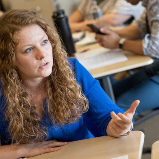 A teacher/aspiring school leader having a conversation in a classroom