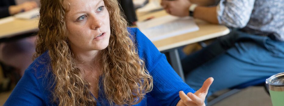 A teacher/aspiring school leader having a conversation in a classroom