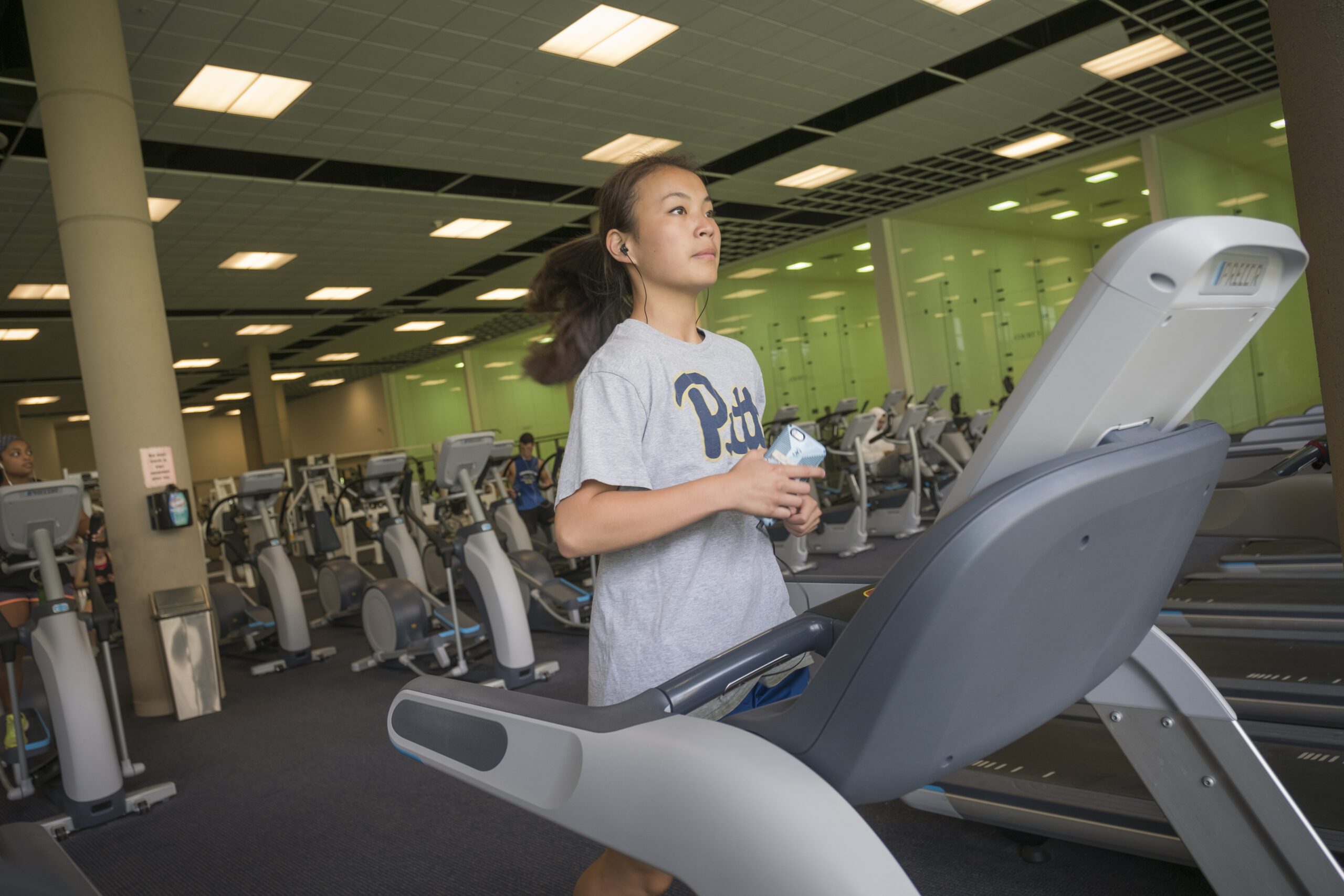 Girl running on a treadmill