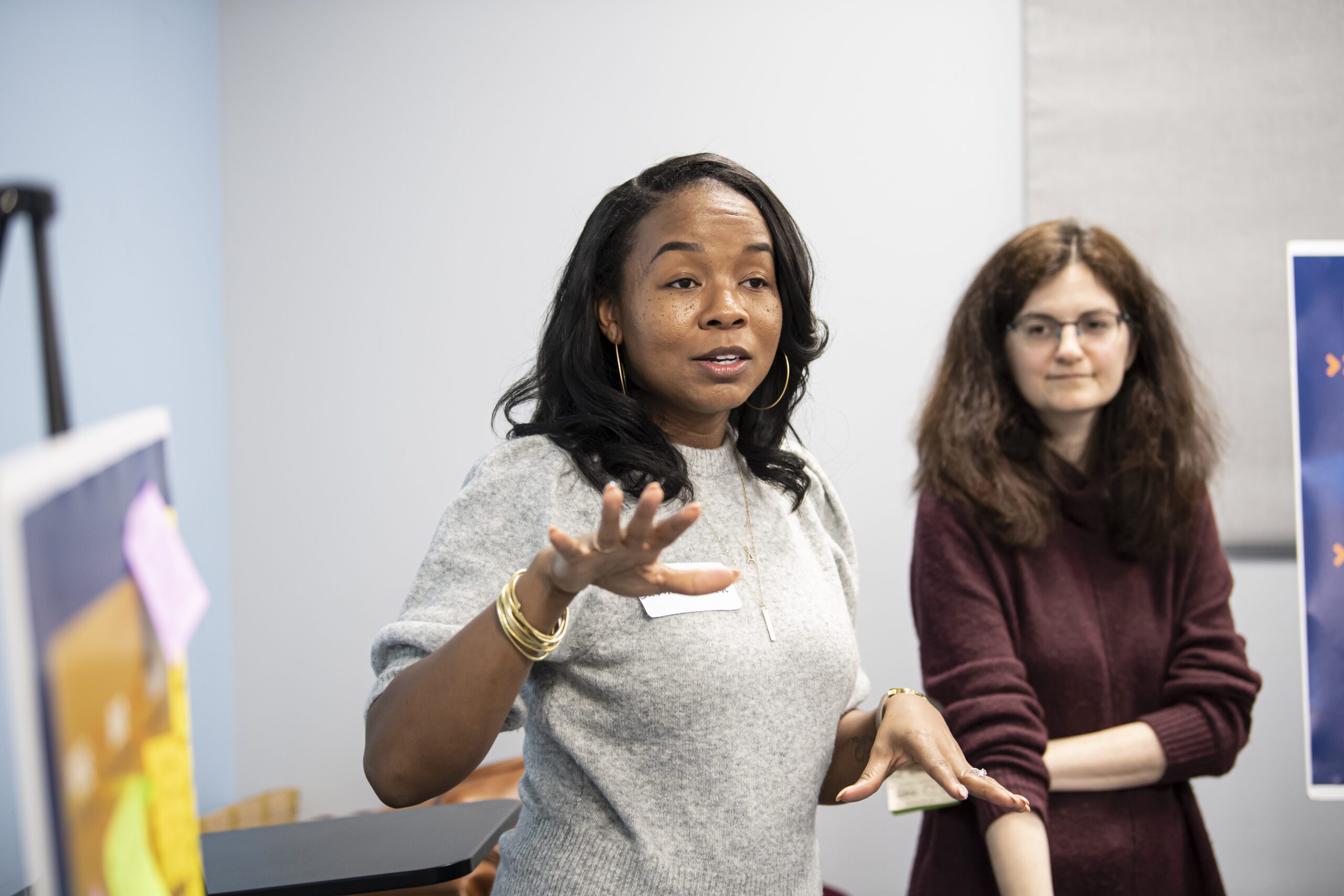 A presenter stands to give a talk at the Community Engagement Center in Homewood in Pittsburgh