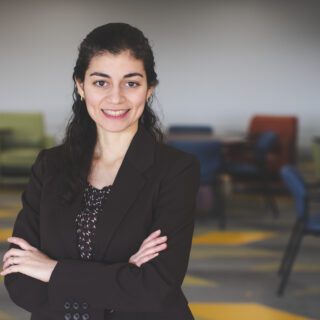 Student Haya Abdellatif standing in a classroom