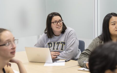 Students learning in a group in the classroom