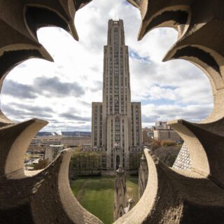 Cathedral viewed through a hole in a building
