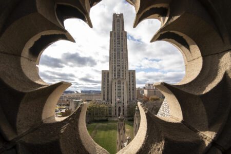 Cathedral viewed through a hole in a building