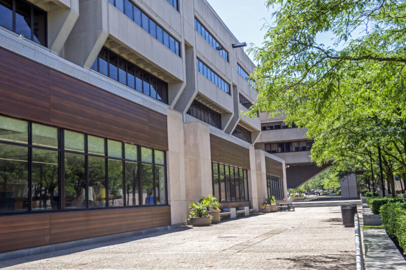 Posvar Hall exterior by trees and renovated classrooms