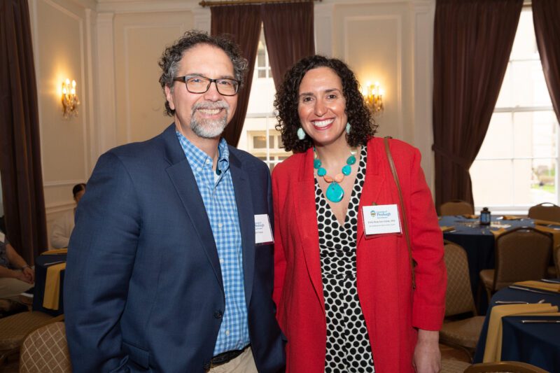 Two people pose for a photo at the 2023 Distinguished Alumni Awards.