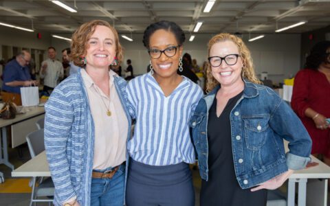 Three faculty members standing together for a picture