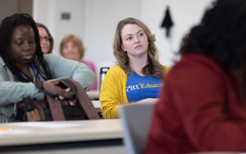 Woman in a Pitt education t-shirt