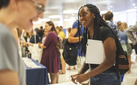 Student talking to staff member about financial aid support