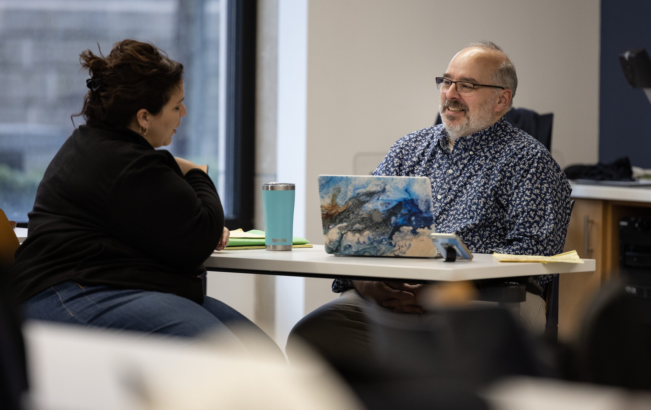 Professor Mike Gunzenhauser talks with a student