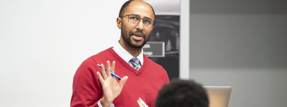 Person presenting at a podium