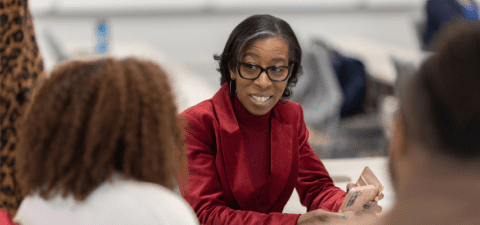 Dr. Eboni M. Zamani-Gallaher speaking to people at an event