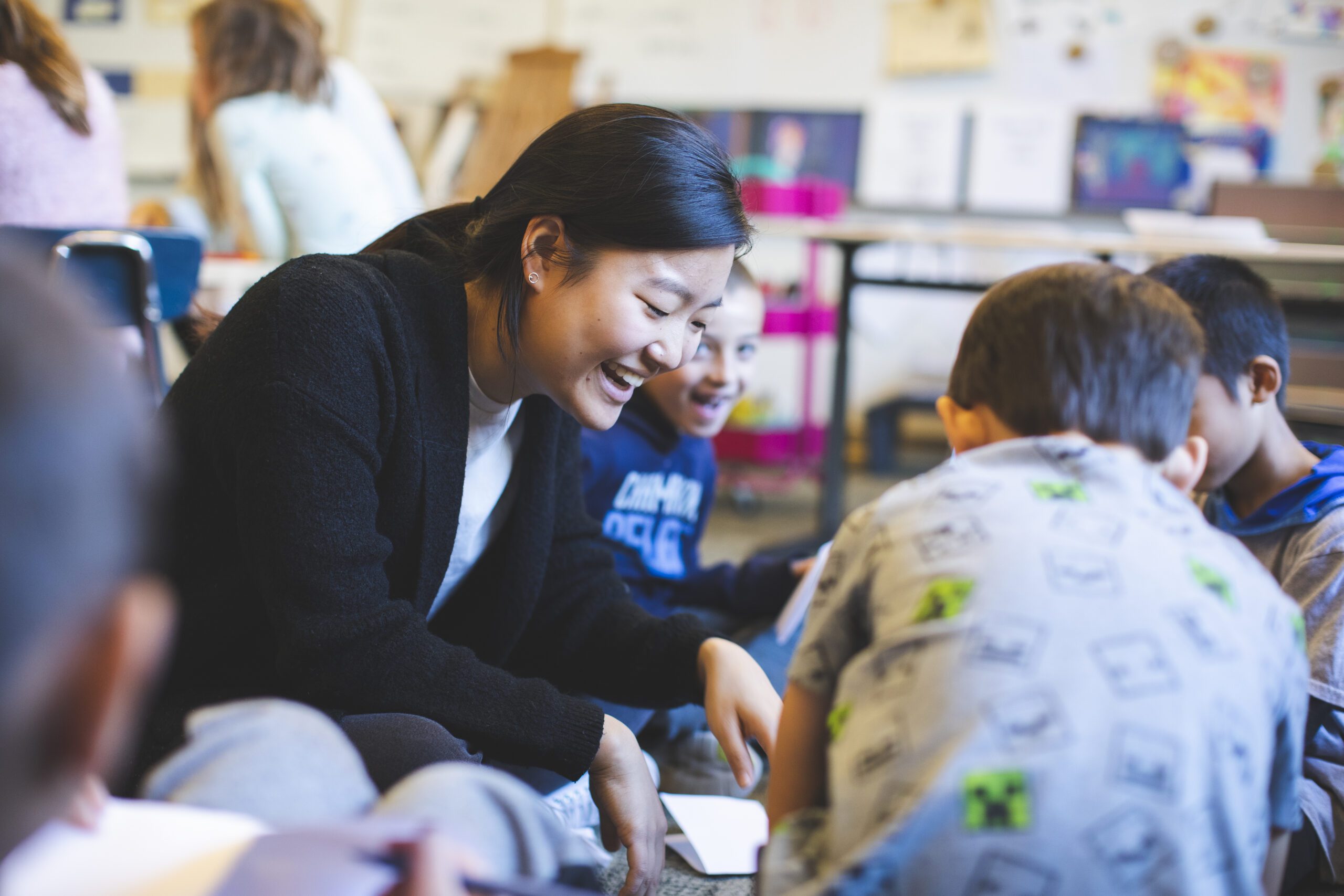 A student teacher in the classroom leading a group of students