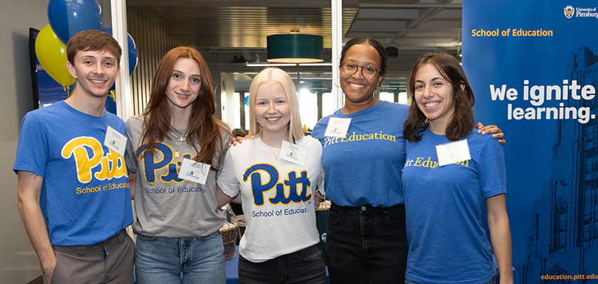 Five students in Pitt t-shirts