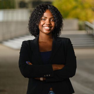 C'enna Crosby standing outside on the Pitt campus