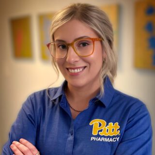 Ashley Yarabinec wearing a blue Pitt Pharmacy shirt