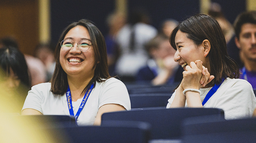 Two international students talking at orientation