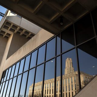 Cathedral of Learning reflected on Posvar Hall windows