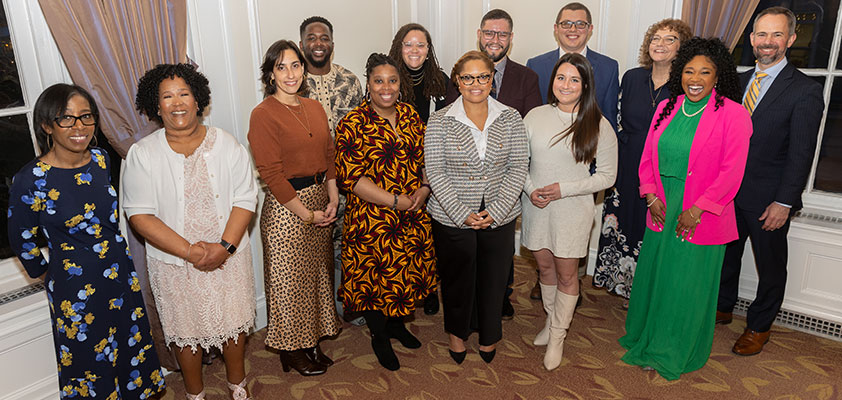 Distinguished Alumni Award winners in a group photo from 2024