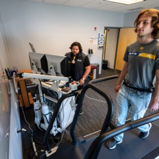 A student is monitored while on a treadmill using equipment at the Physical Activity Research Center (PARC) at the University of Pittsburgh.