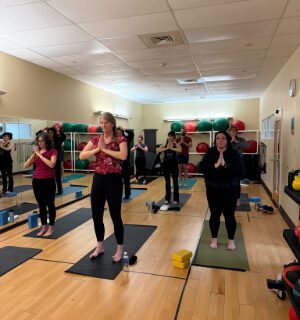 Faculty and staff participating in a yoga session
