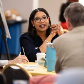 Participants talk at the table at the Transfer Pathways Summit