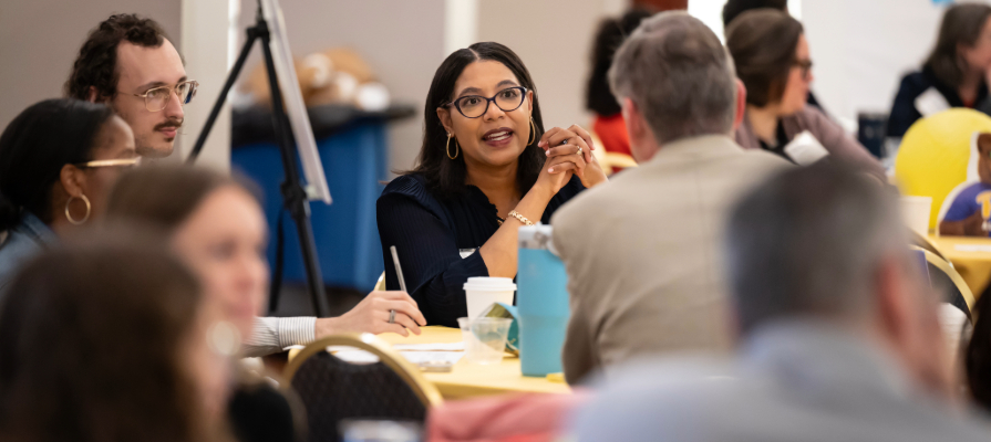 Participants talk at the table at the Transfer Pathways Summit