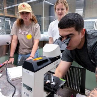 A student using a microscope