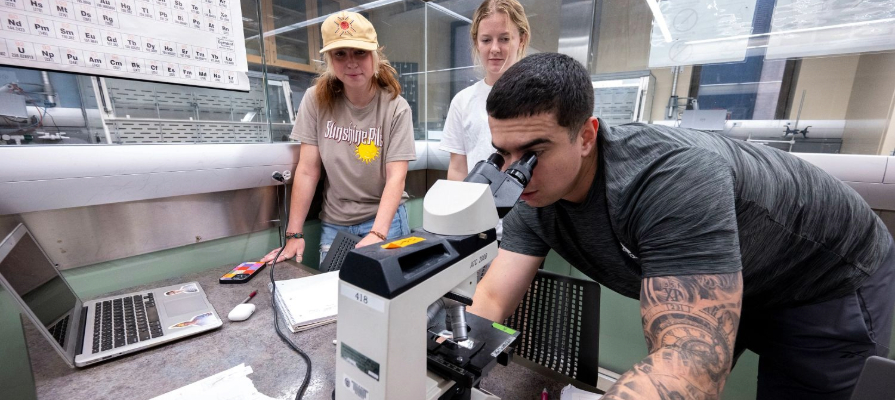A student using a microscope