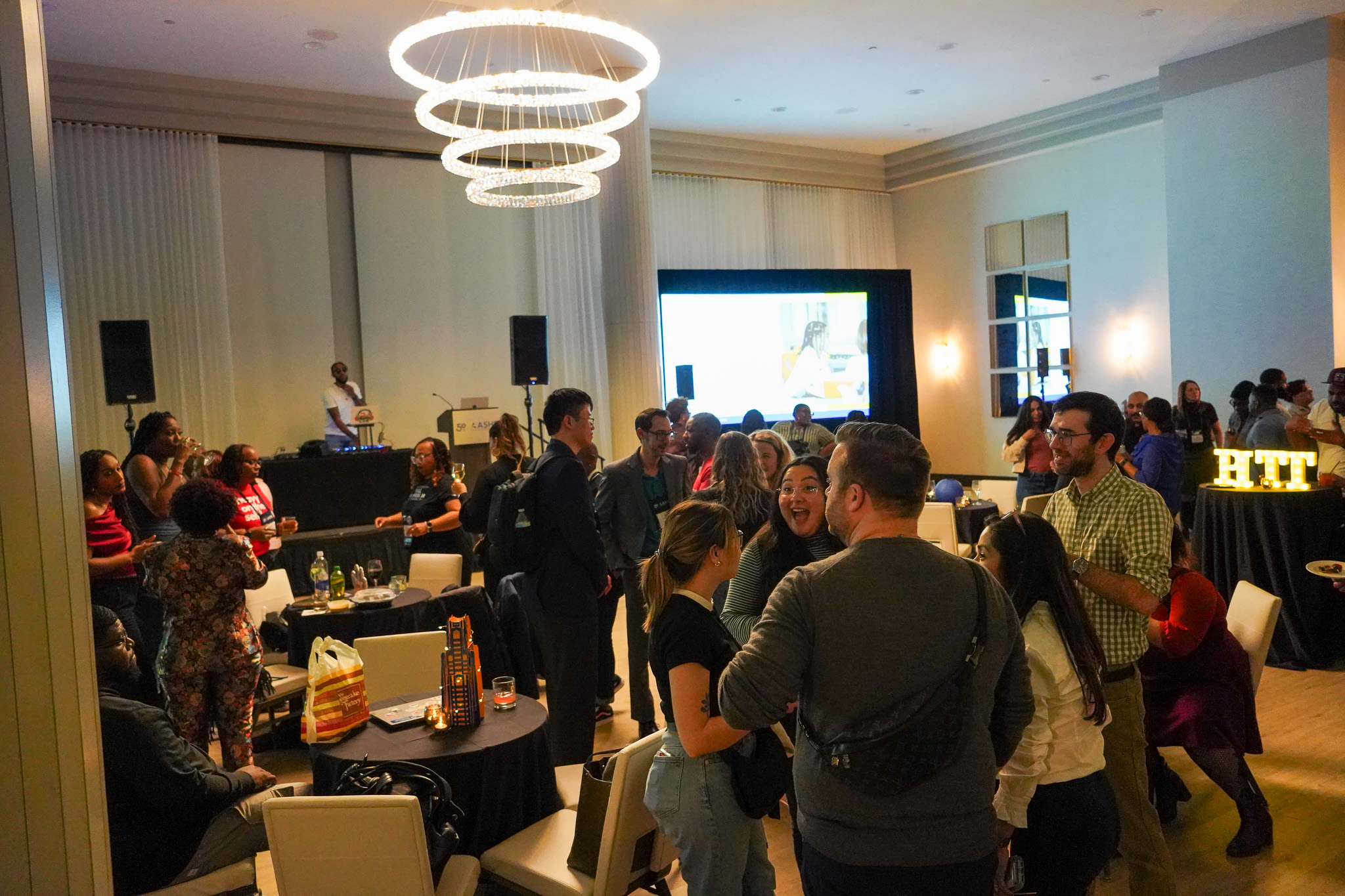 A crowd is gathered for the School of Education reception at the 2025 ASHE Conference.