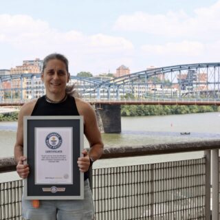 Laura Hunt holds up her Guinness World Record certificate in Pittsburgh.