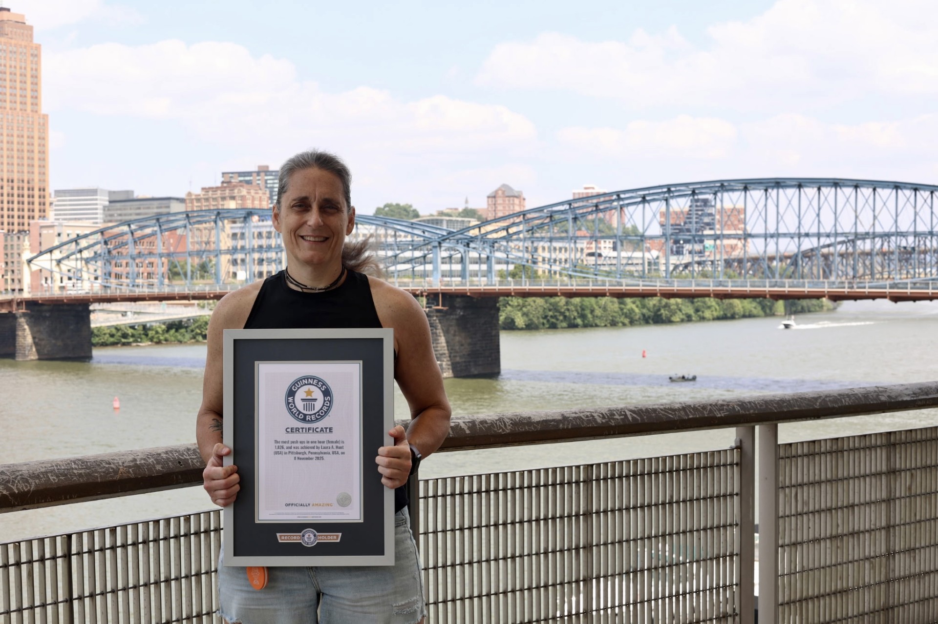 Laura Hunt holds up her Guinness World Record certificate in Pittsburgh.